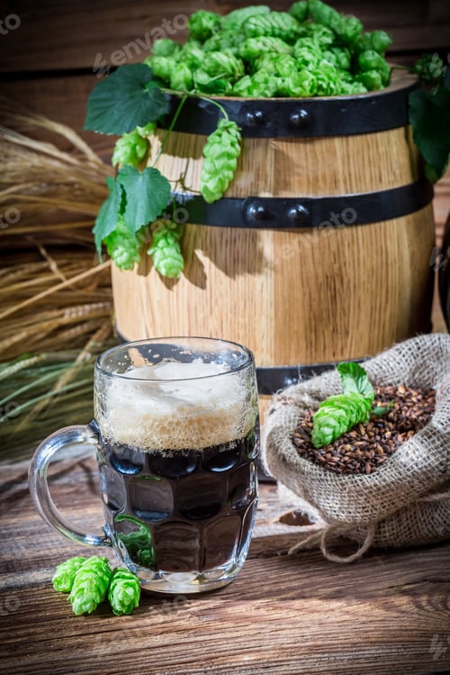 Preview: Homemade dark beer on old wooden table
