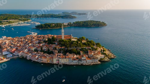 Preview: Aerial view of Rovinj, Croatia showcasing its vibrant coastline and historic architecture at sunset