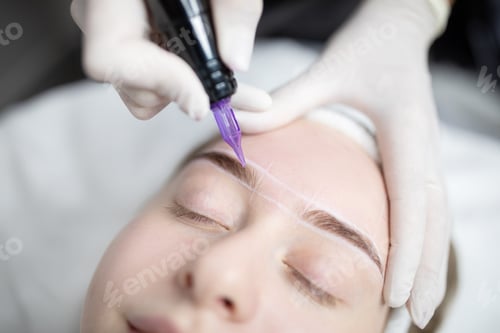 Preview: Woman enjoying a pampering session with permanent makeup application at a salon