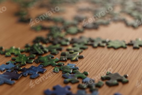 Preview: Scattered green jigsaw puzzle pieces on wooden table