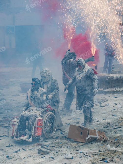 Preview: Ibi, Spain - December, 28 2018: People celebrating victory in flour and eggs battle