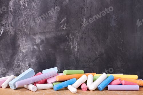 Preview: Colorful chalks near the blackboard.