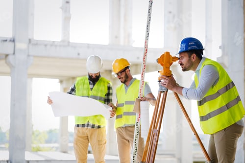 Preview: Portrait of construction engineers working on building site