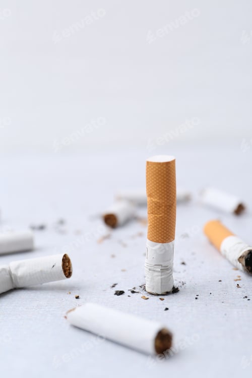 Preview: Many cigarette butts on light background. Smoking habit