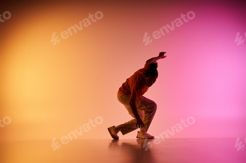 Preview: Young dancer moves with grace on a colorful stage