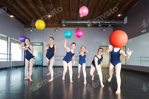 Preview: Group of kids playing dodge ball in dance studio having fun