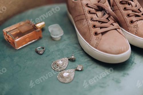 Preview: Wedding day details of earrings , shoes , perfume and engagement ring