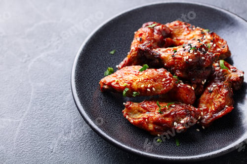 Preview: Chicken wings. Traditional asian recipe. Grey background. Close up.