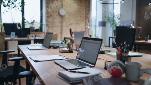 Preview: Modern company office interior without people. Loft style of corporate workplace