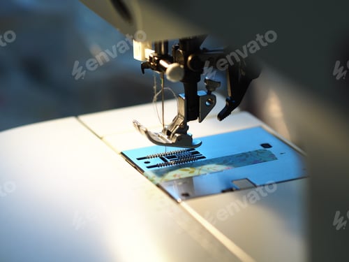 Preview: Closeup shot of a tailor's electronic machine sewing clothes