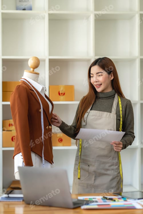 Preview: Successful fashion designer. Full length of attractive young asian woman looking at camera with smil