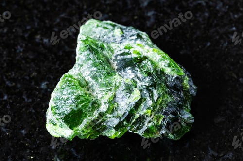Preview: sample of rough chrome diopside mineral on black