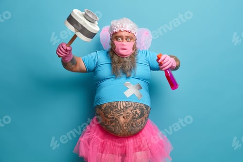 Preview: Funny bearded man does spring cleaning during quarantine at home, poses with detergent and toilet pa