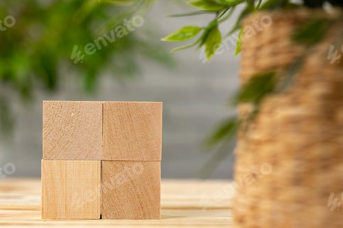 Preview: Blank wooden cubes with copy space for your design on office working table