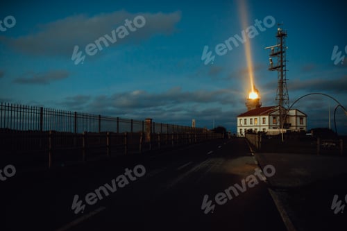 Preview: Road and lighthouse in evening