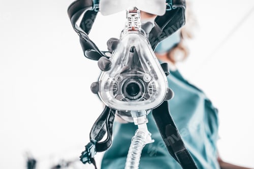 Preview: Nurse applies a mask of the mechanical ventilation machine.