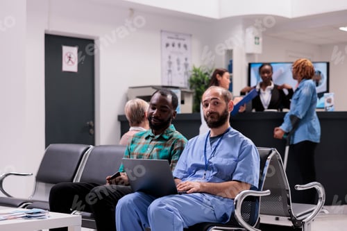 Preview: Medical nurse talking to male patient about diagnosis