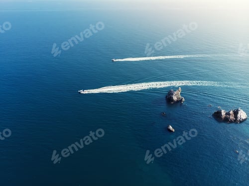 Preview: Aerial drone pov top view two coast border guard boat ships sailing fast in clean blue ocean or sea