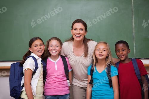 Preview: Schoolteacher Posing With Her Pupils In A Classroom