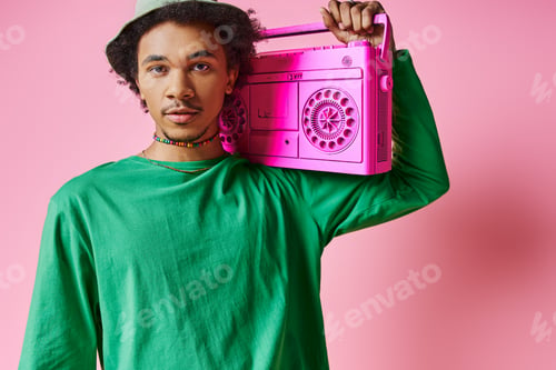 Young Man in Green with Pink Boombox
