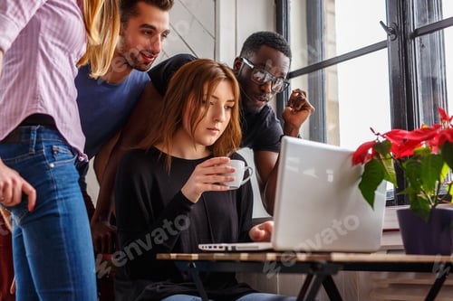 Preview: Group of international students using laptop.