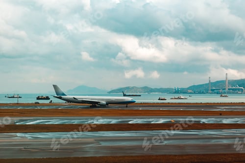 Preview: Airport with many airplanes at beautiful sunset