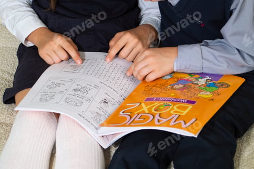 Preview: children sit on the floor and write in a notebook