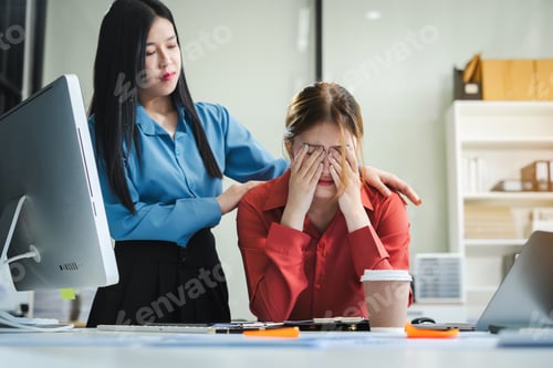 Preview: Serious businesswoman concentrating on his paper work at the table at office.