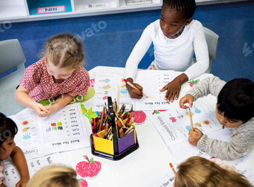 Preview: Group of diverse Kids coloring workbook in class