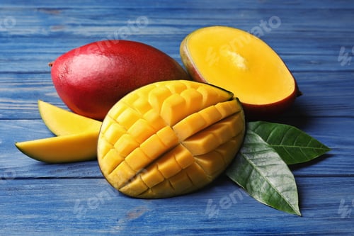 Preview: Composition with fresh mango on wooden background