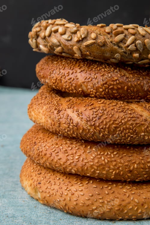 Preview: side view of turkish bagels on blue surface and black background