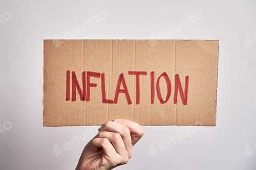 Preview: World inflation concept. Woman hold sheet with word inflation