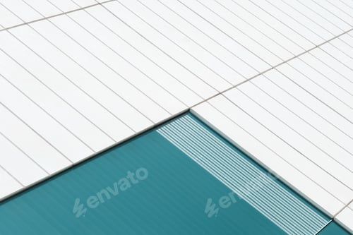 Preview: Abstract modern building facade featuring geometric lines and teal color
