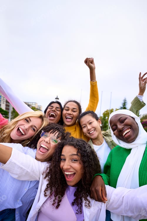 Preview: Smiling Women Posing Together in a City