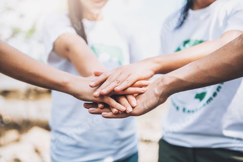 Vista previa: Close up of people volunteer teamwork putting hands together,Stack of hands,Unity and teamwork