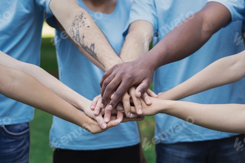 Preview: Young happy volunteers outdoor meeting at park