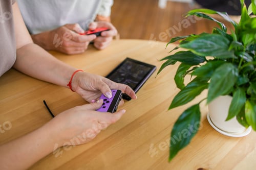 Preview: Hands using game controller. Playing video games