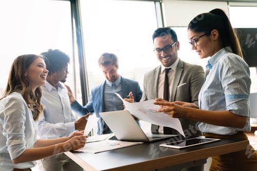 Preview: Portrait of successful business team working in office