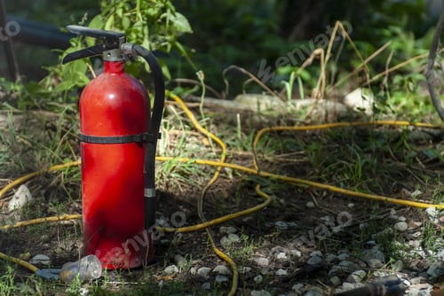 Preview: Closeup shot of a water extinguisher and firehose
