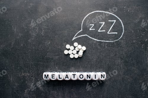 Preview: White pills in Z shape and text. Sleeping pills, hypnotic drugs, sedative, melatonin on dark night