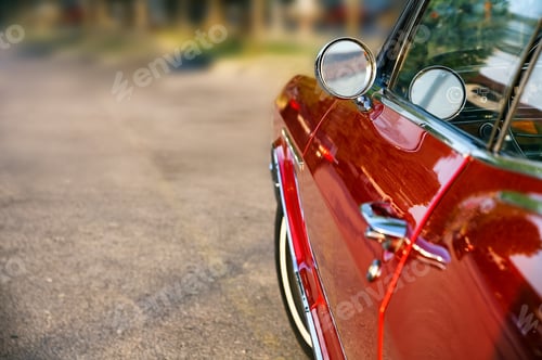 Preview: Selective focus shot of a red vintage car