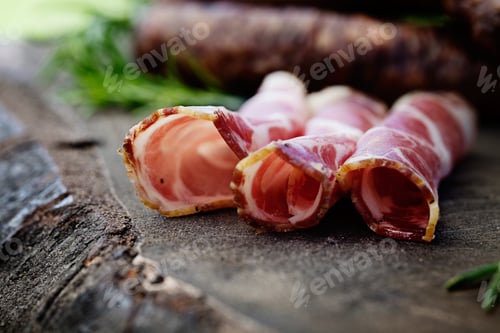 Delicious Cured Meat Rolls on Wooden Surface