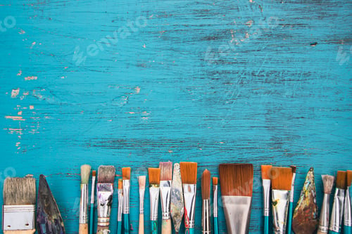 Preview: Paint brushes with palette knives on blue background