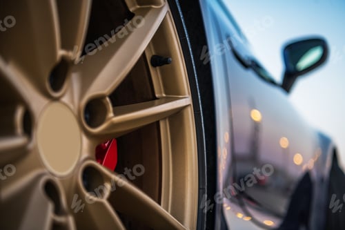 Preview: Close Up Of Golden Tire Rim Of Exotic Car.