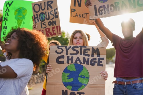Preview: Group of young multiracial people demonstrate on city street against climate change