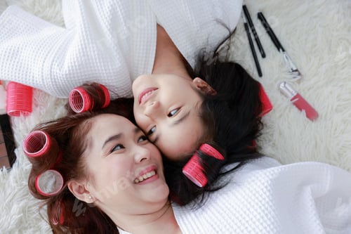 Preview: Mother and Daughter Relaxing with Hair Curlers On