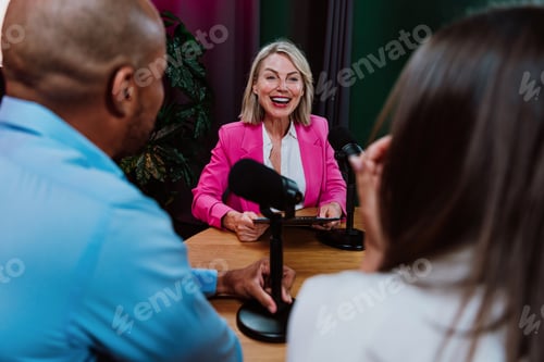 Preview: Content creators recording a podcast interview in studio