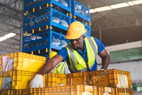 Preview: African American Industrial Factory Workers Collaborating in Warehouse for Efficient Distribution.