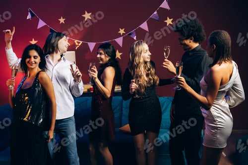 Preview: Diverse friends celebrating special occasion with sparkling wine