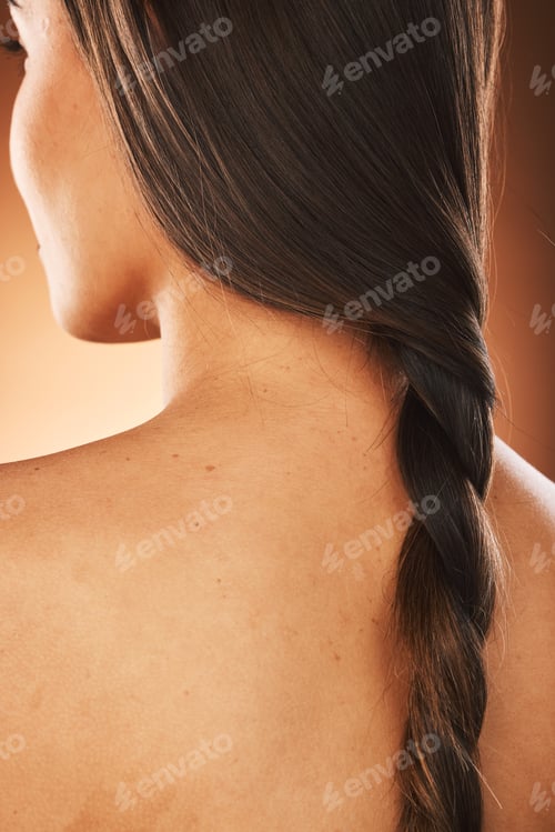 Preview: Hair, beauty and back of woman with braid for hair care, hair salon and luxury in orange background